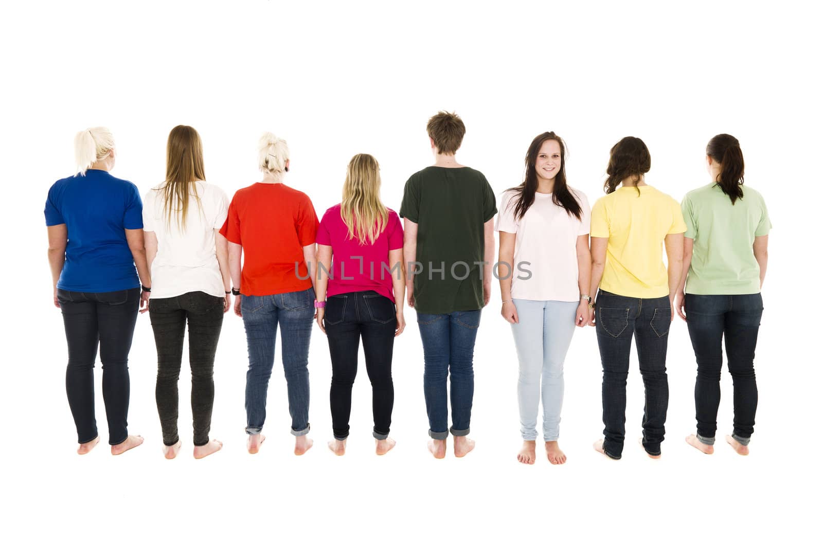 People in a row with one of them facing the camera