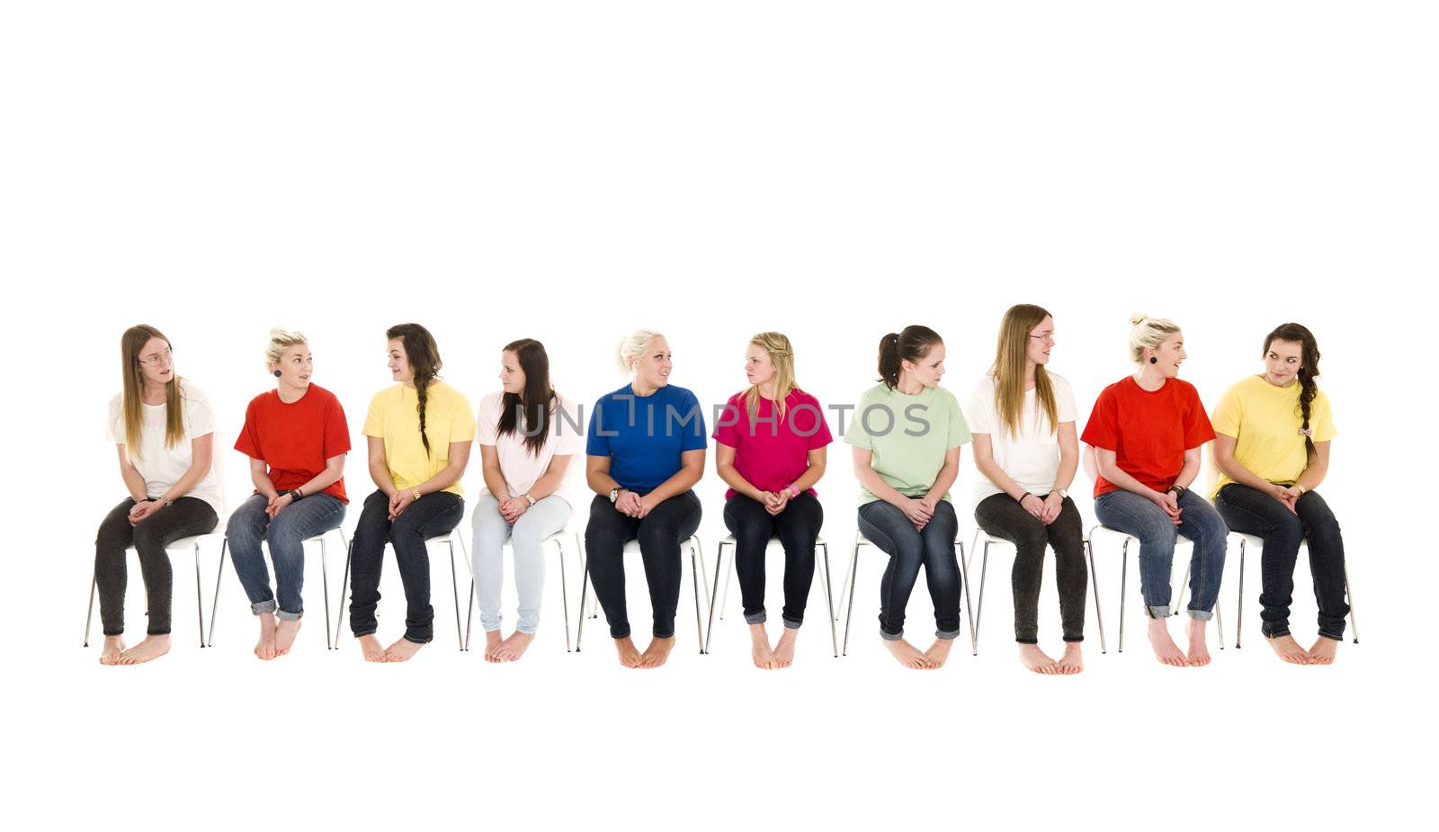 Group of women on chairs in a line by gemenacom