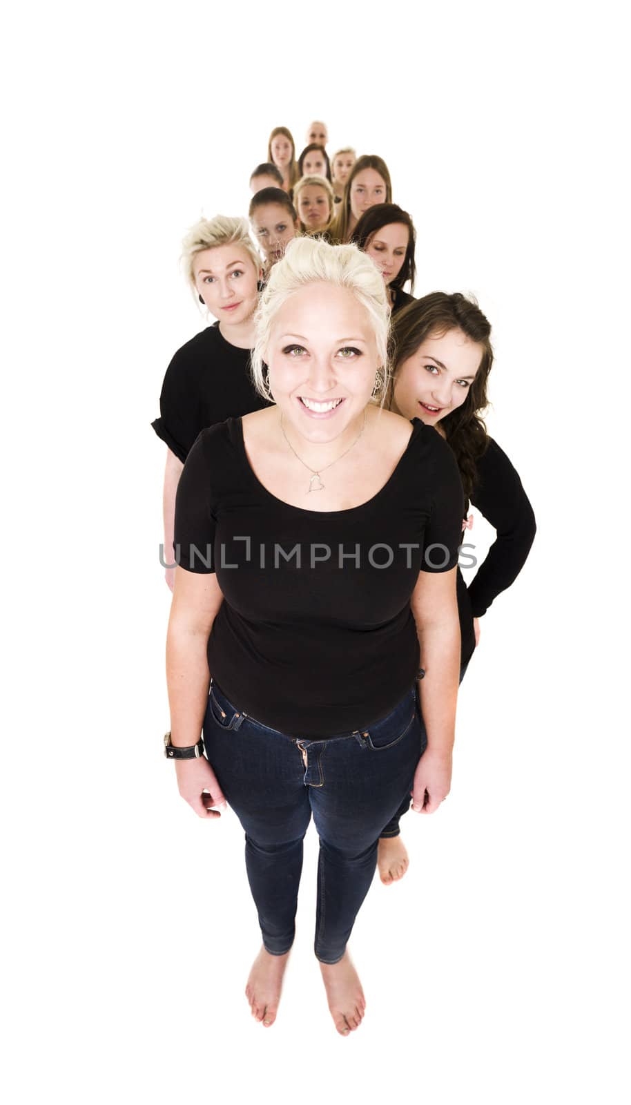 Large group of young women in a line isolated on white background