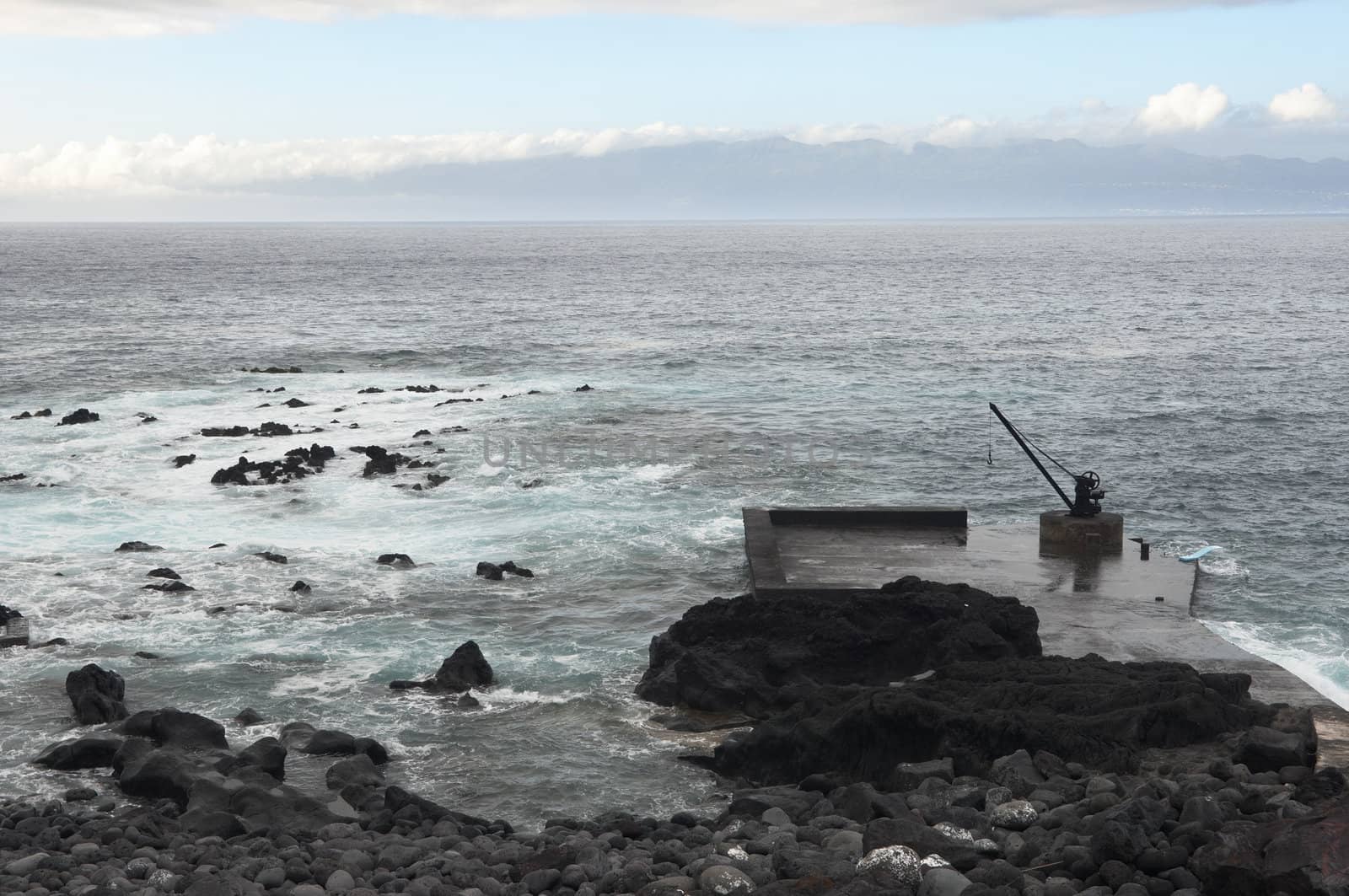 Small deserted quay in the coast of Pico island, Azores