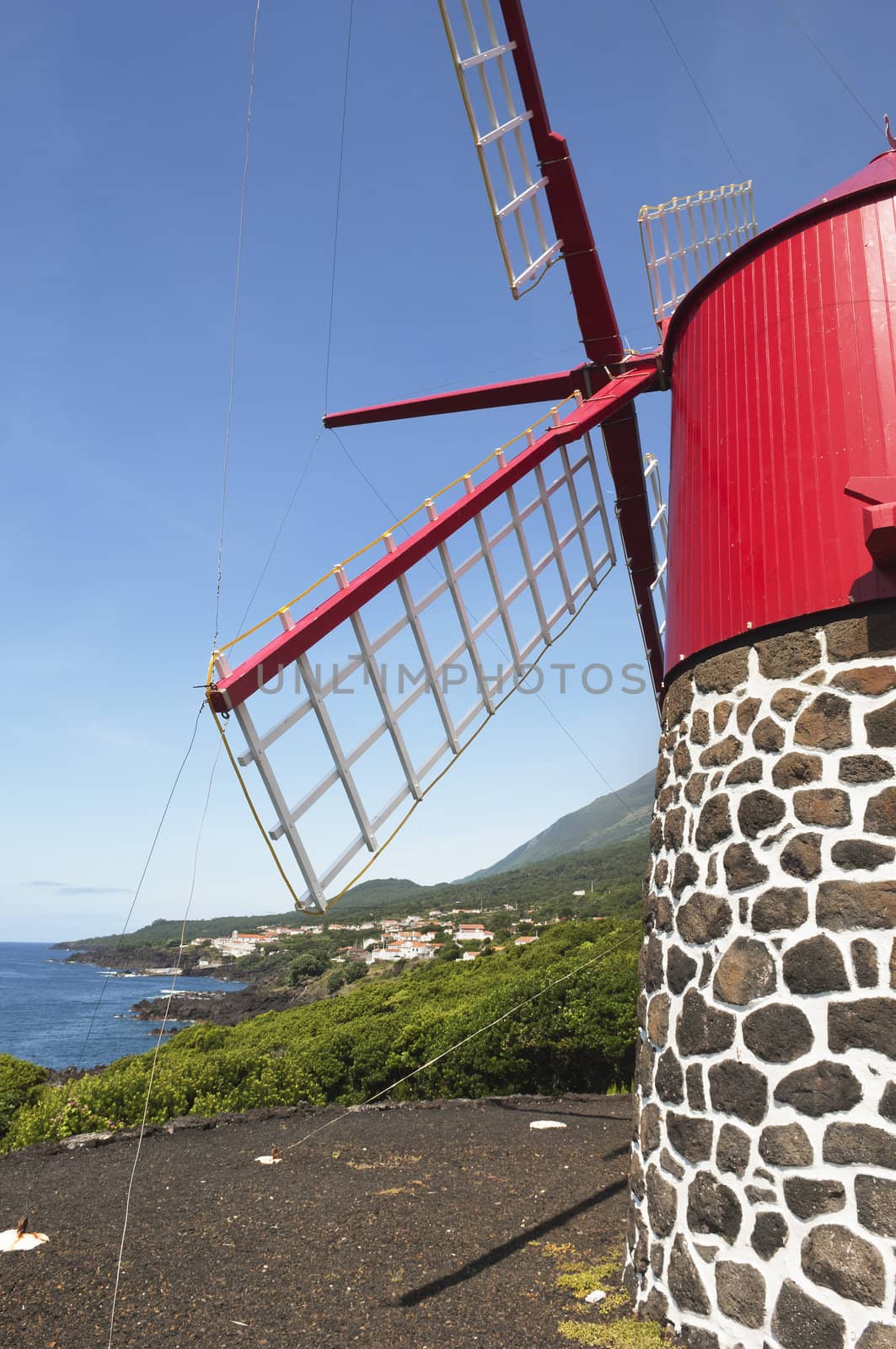 Red windmill in the coast of Pico island, Azores