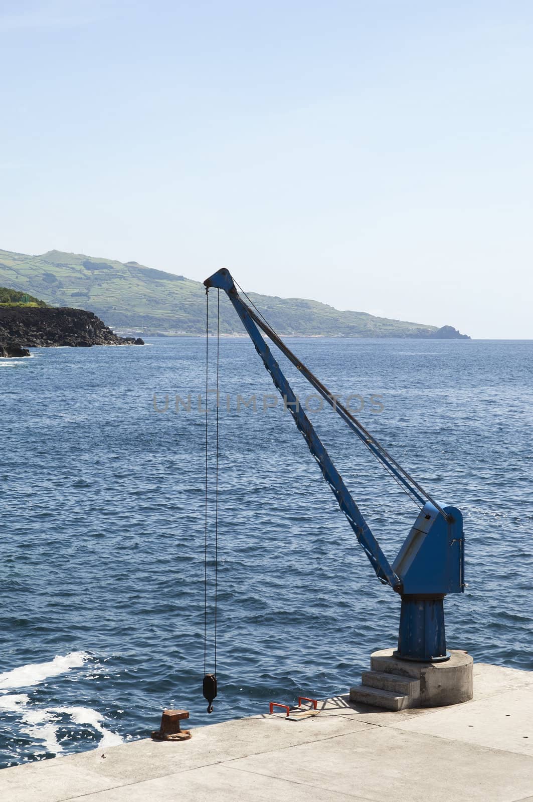 Port crane in a small harbor, Pico, Azores