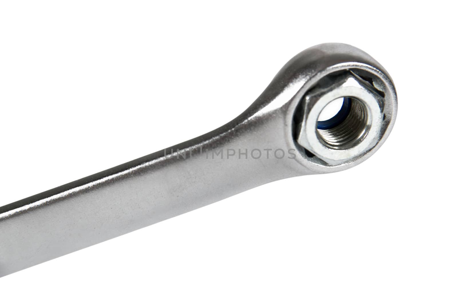 The image of a wrench with a nut, isolated, on a white background
