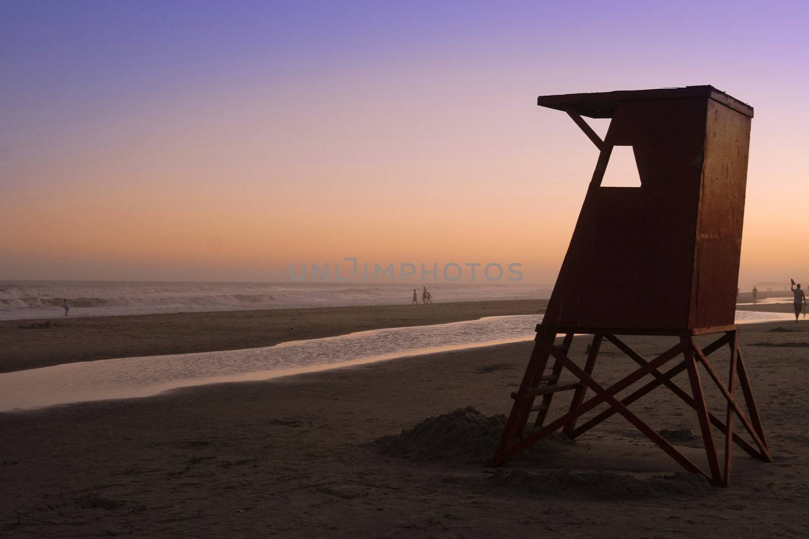 Beautiful quiet sunset at Uruguay beach with lifeguard cabin.