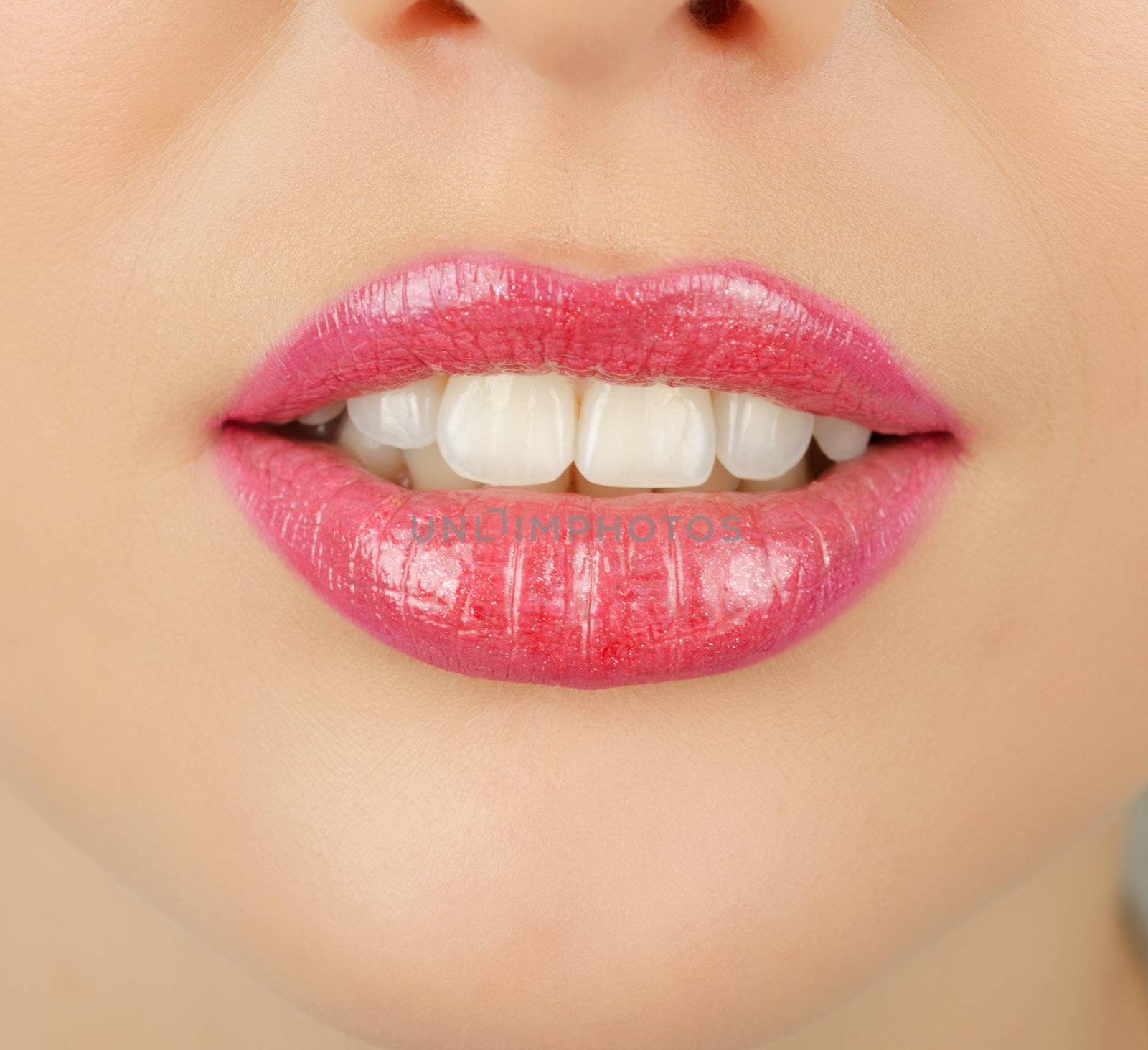 Close up of a young woman's glossy lips