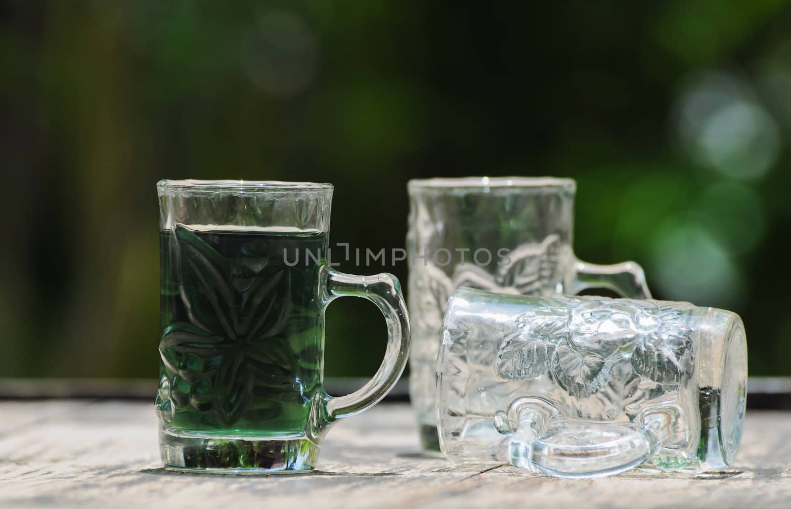 glass with green water