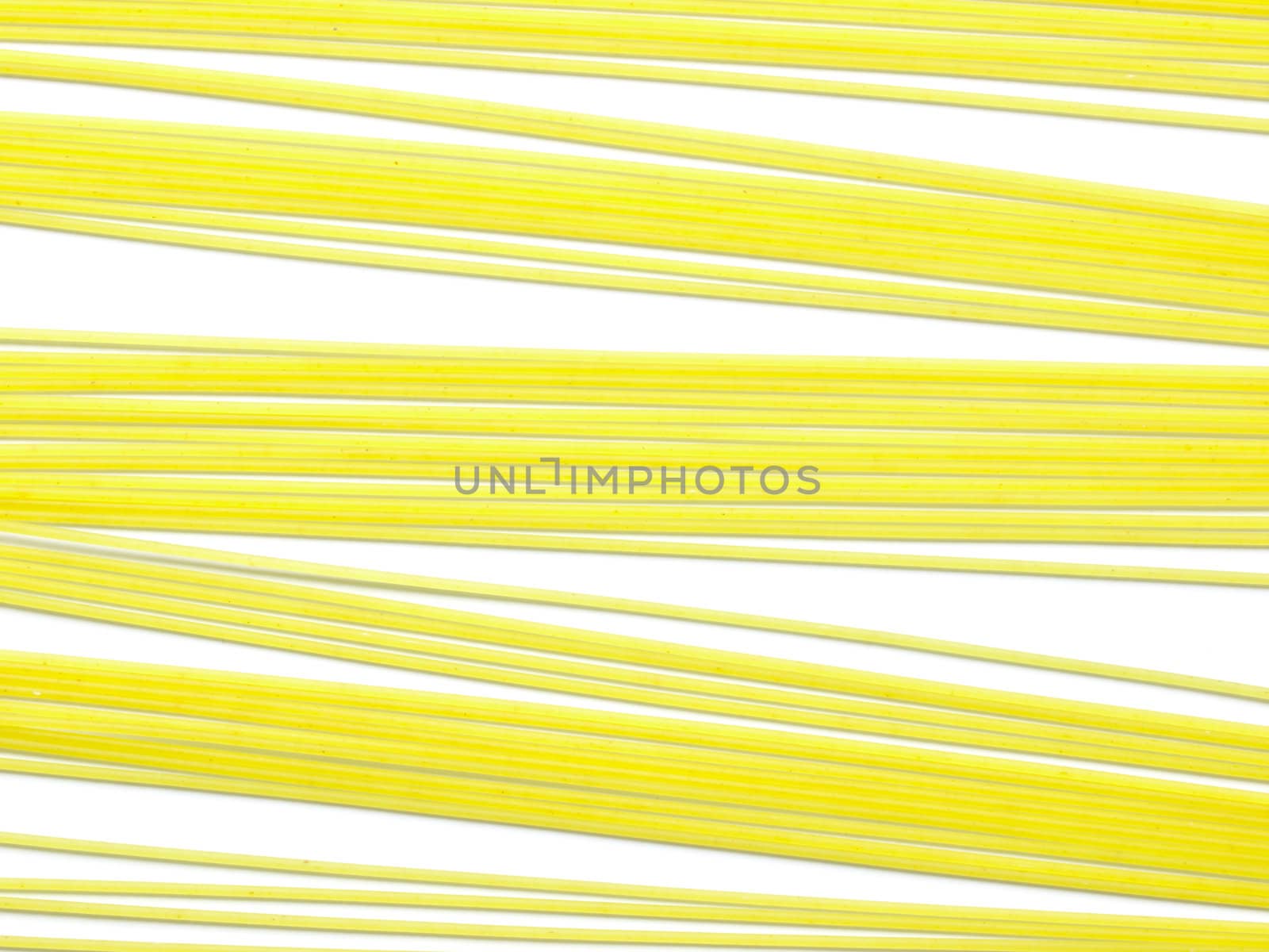 raw spaghetti noodles isolated on white