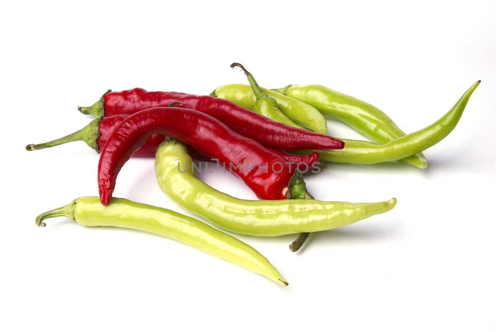 Red and green pepper isolated on white