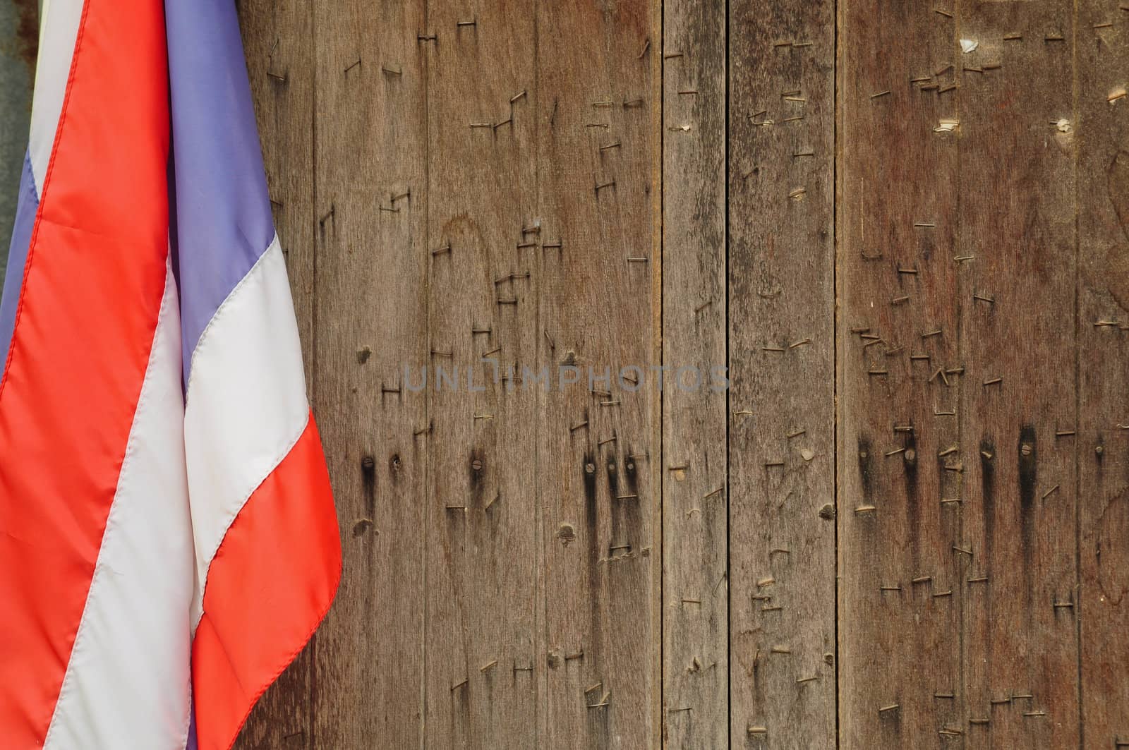 wooden windows and flag in thailand