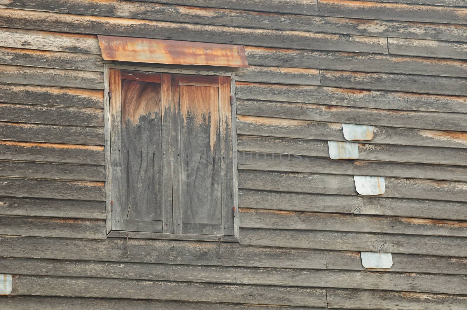 wooden windows of old house in Thailand
