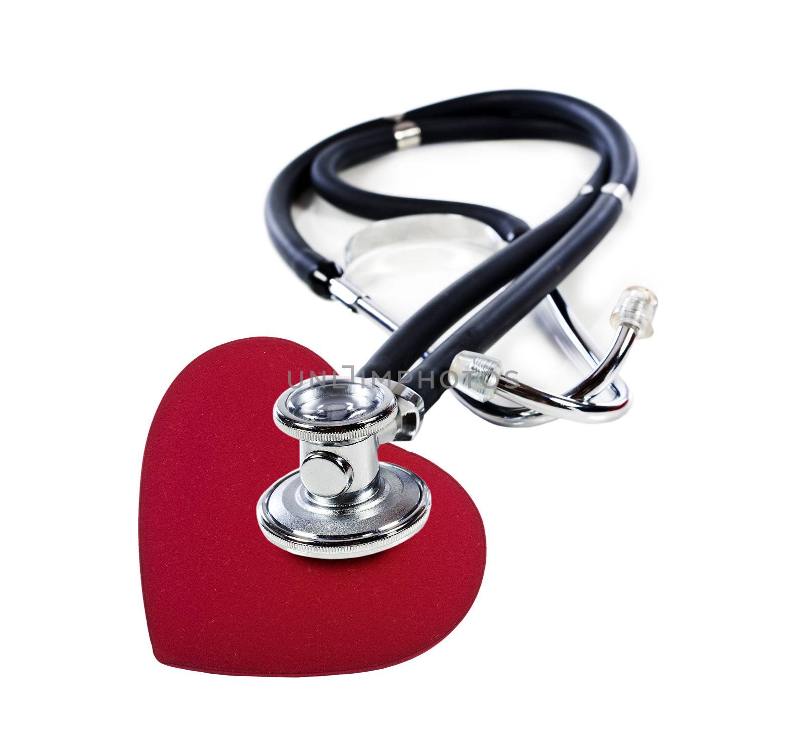 a Doctor's stethoscope listening to a red heart  on a white background with space for text
