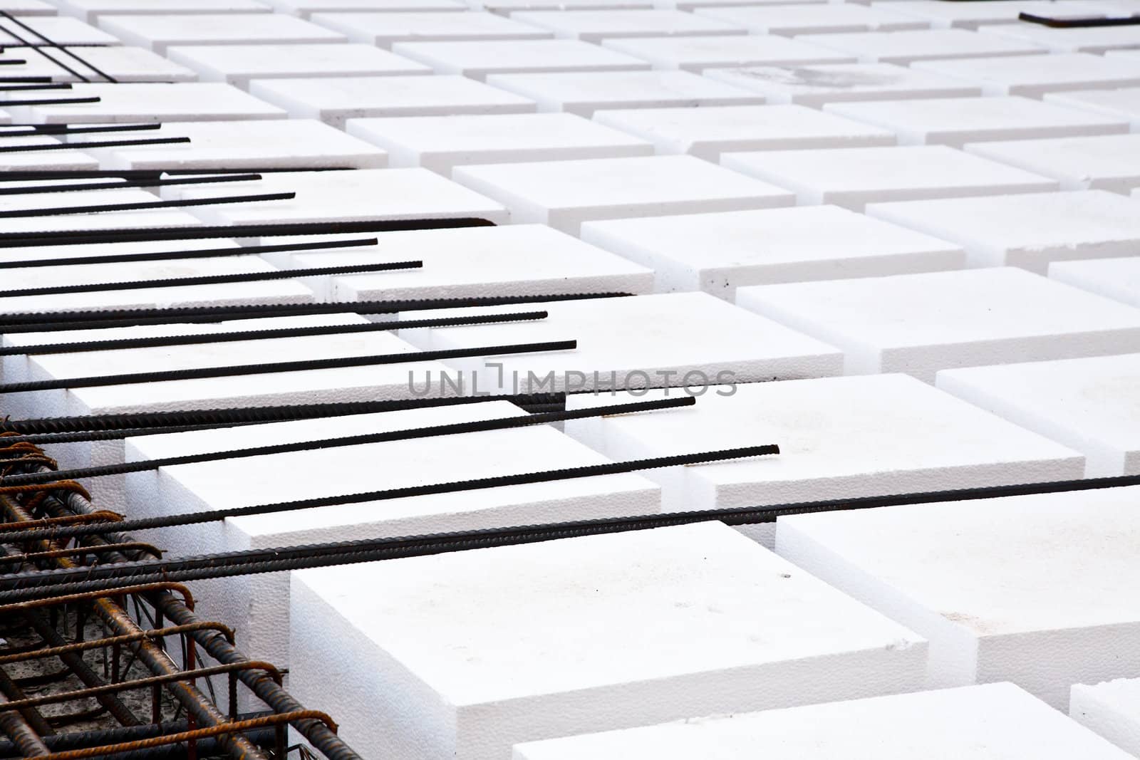 Technical detail of building operations: floor. Materials: polystyrene, steel bars, concrete