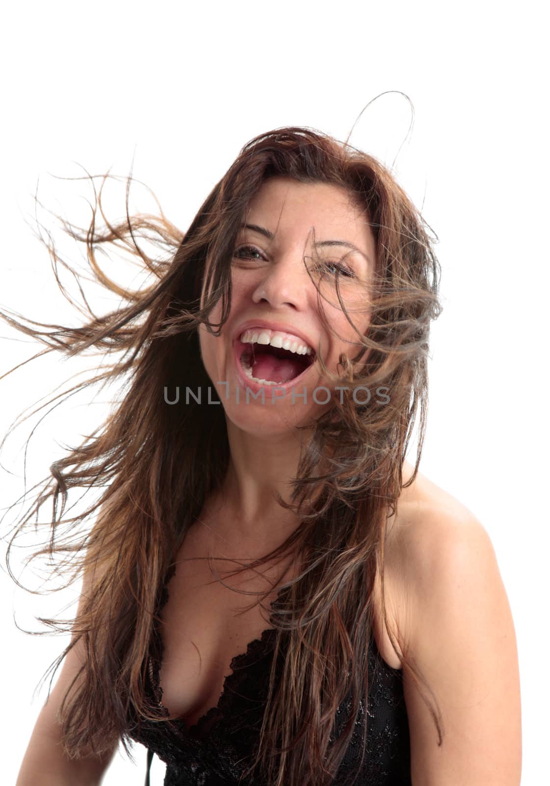 Beautiful woman full of vitality and fun and laughter and zest for life.  Some parts of hair and mouth in motion.