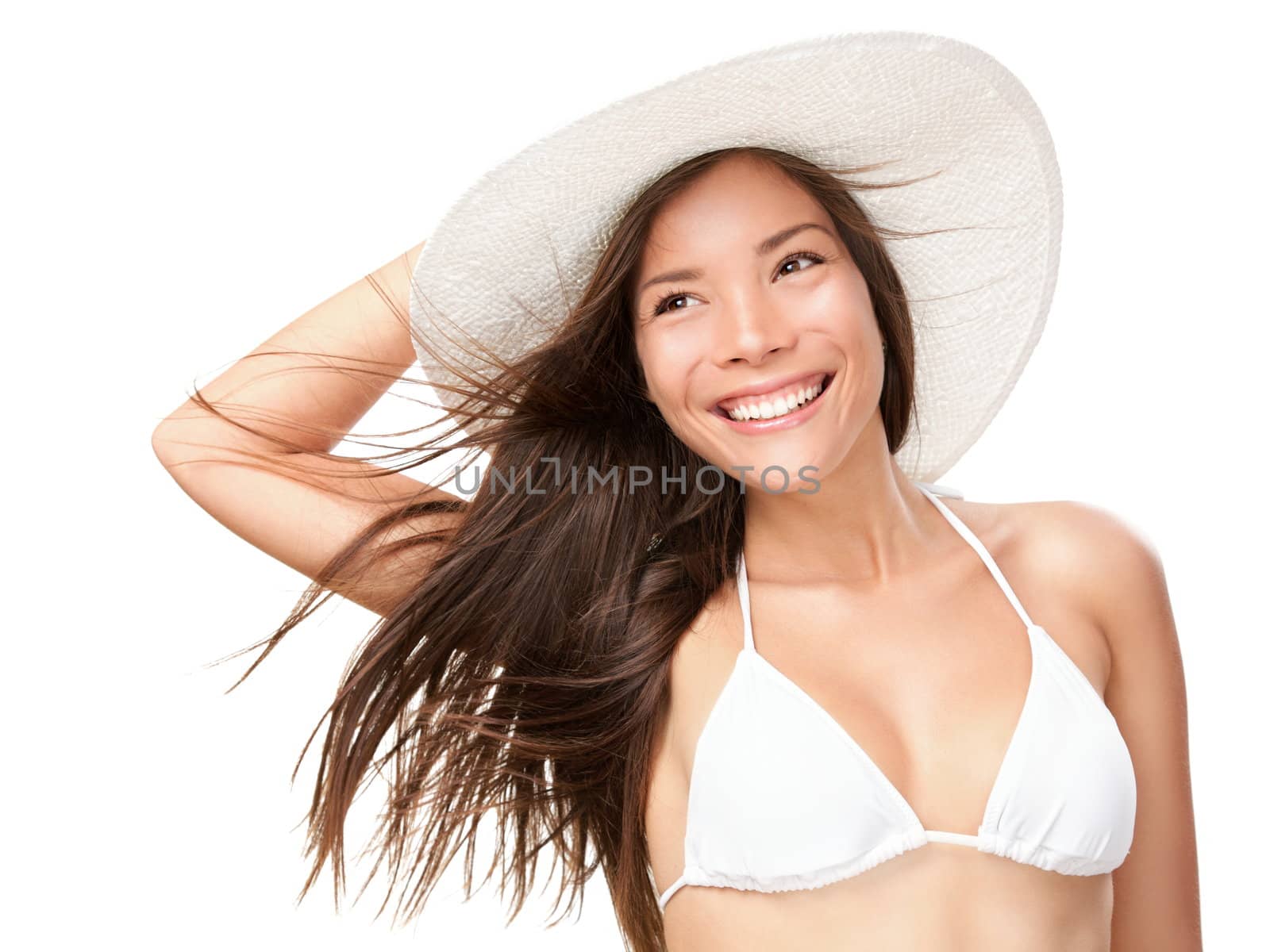 Summer bikini girl isolated. Portrait of young summer woman smiling in white bikini and beach hat. Fresh and pretty Mixed race Asian Caucasian model isolated on white background.