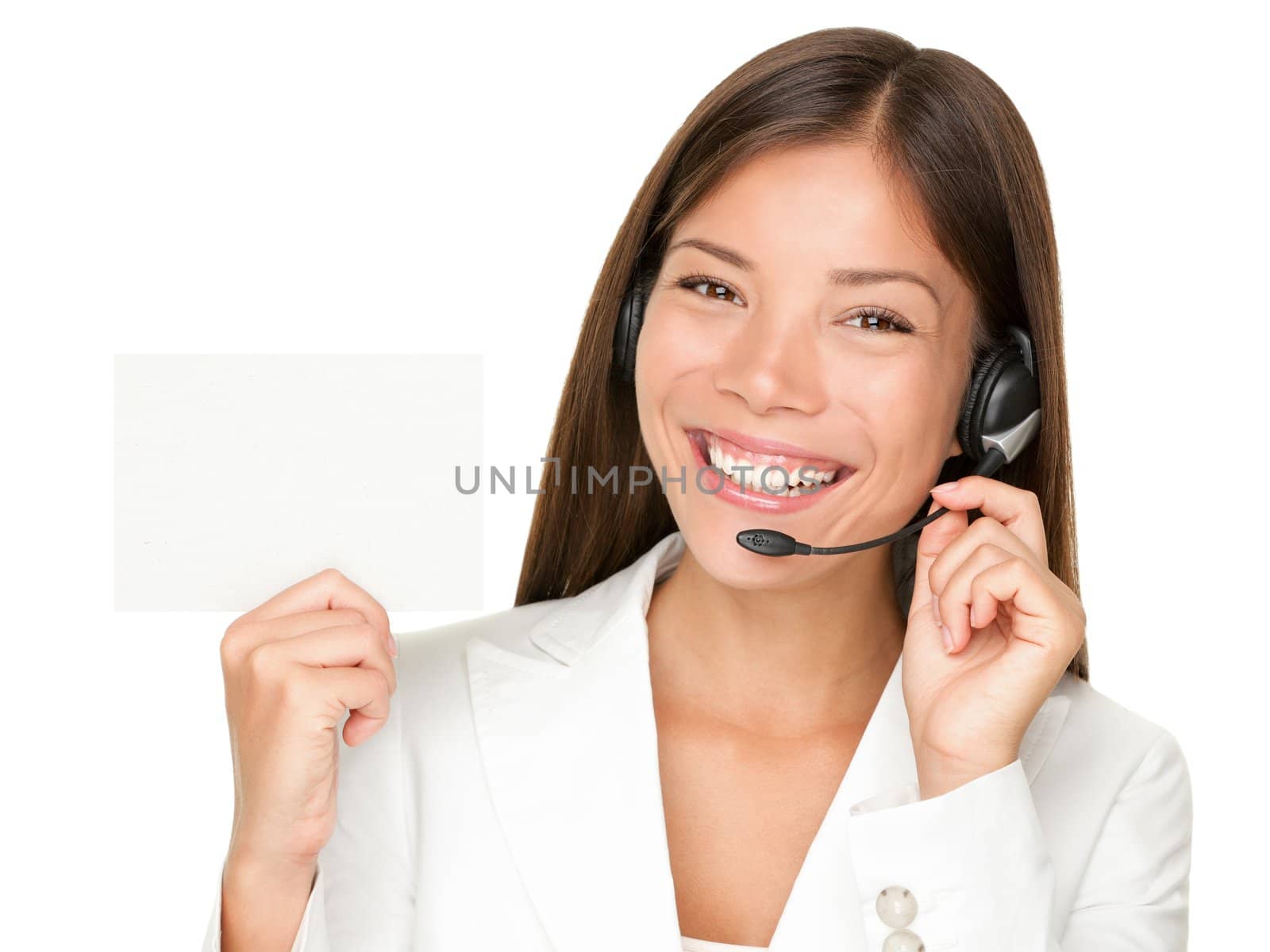 Headset. Customer service operator woman from call center smiling with headset showing blank empty sign card for copy space. Beautiful mixed race Asian Caucasian woman isolated on white background.