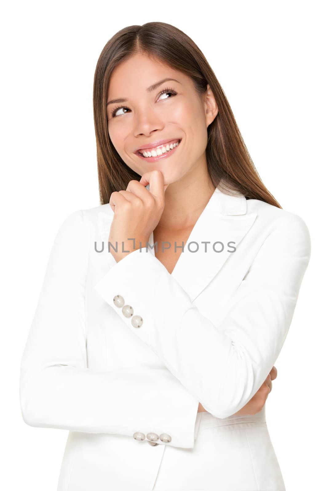 Thinking business woman smiling looking up at copy space. Beautiful young professional isolated on white background.