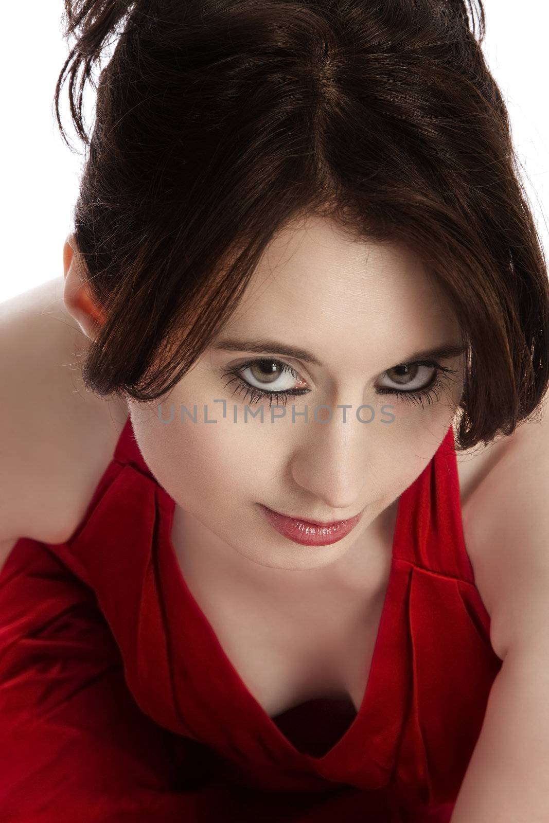 portrait of a young woman sitting in red dress