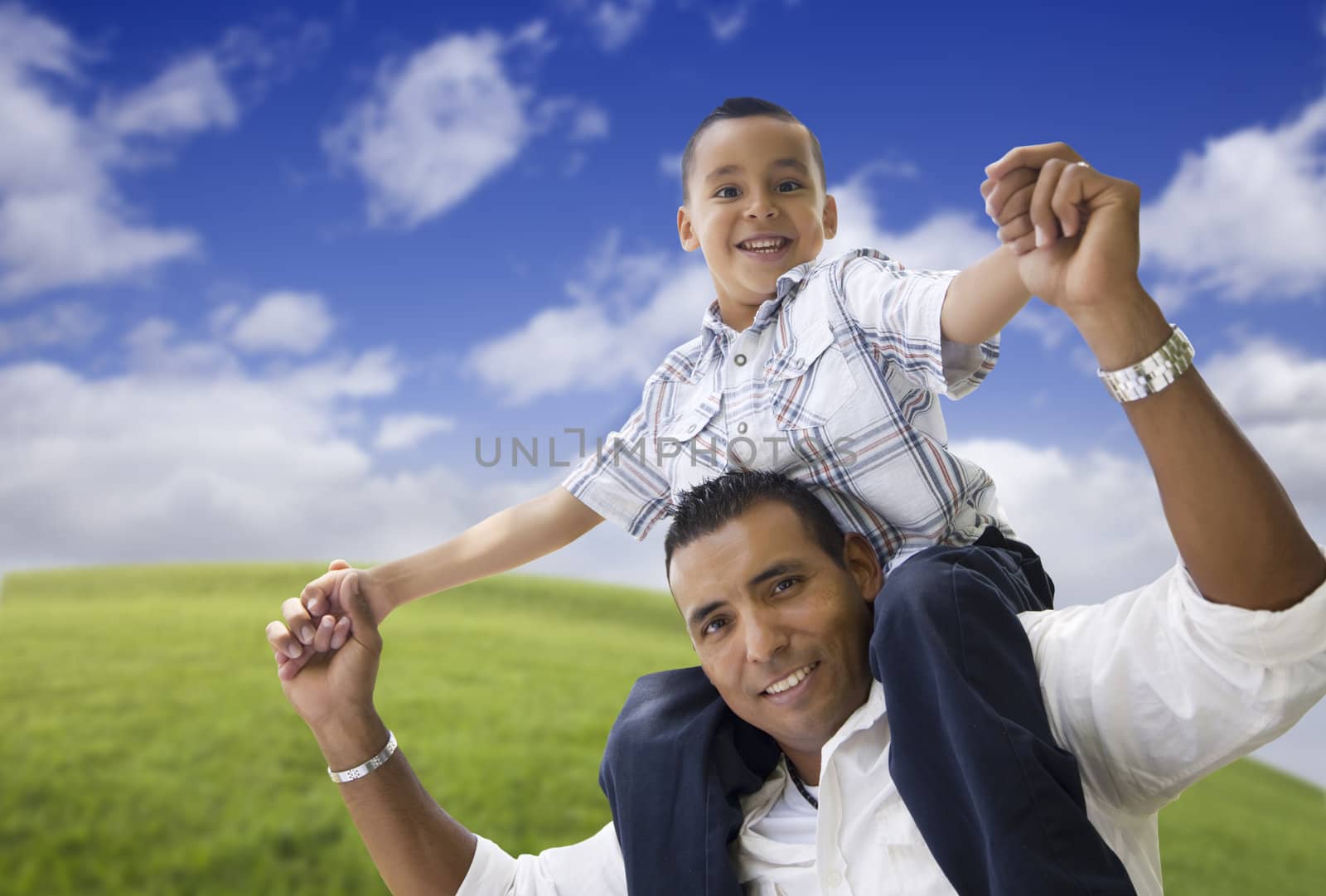 Hispanic Father and Son Having Fun Together in the Park.
