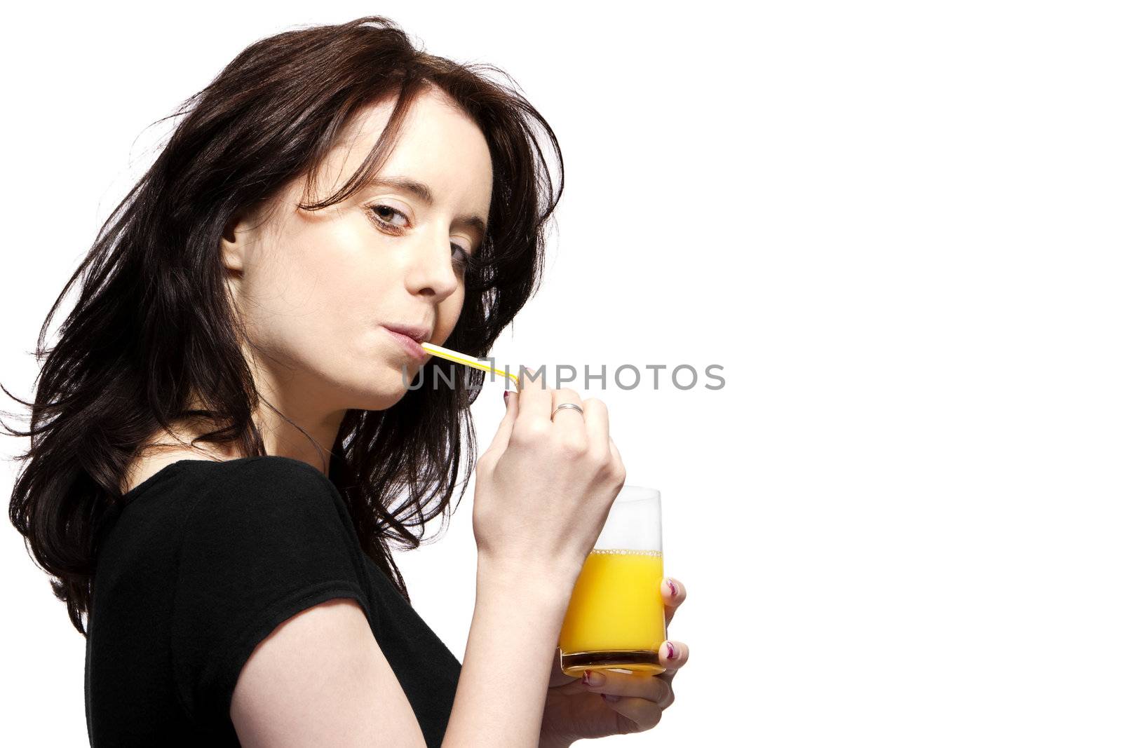 young woman in black shirt drinking orange juice