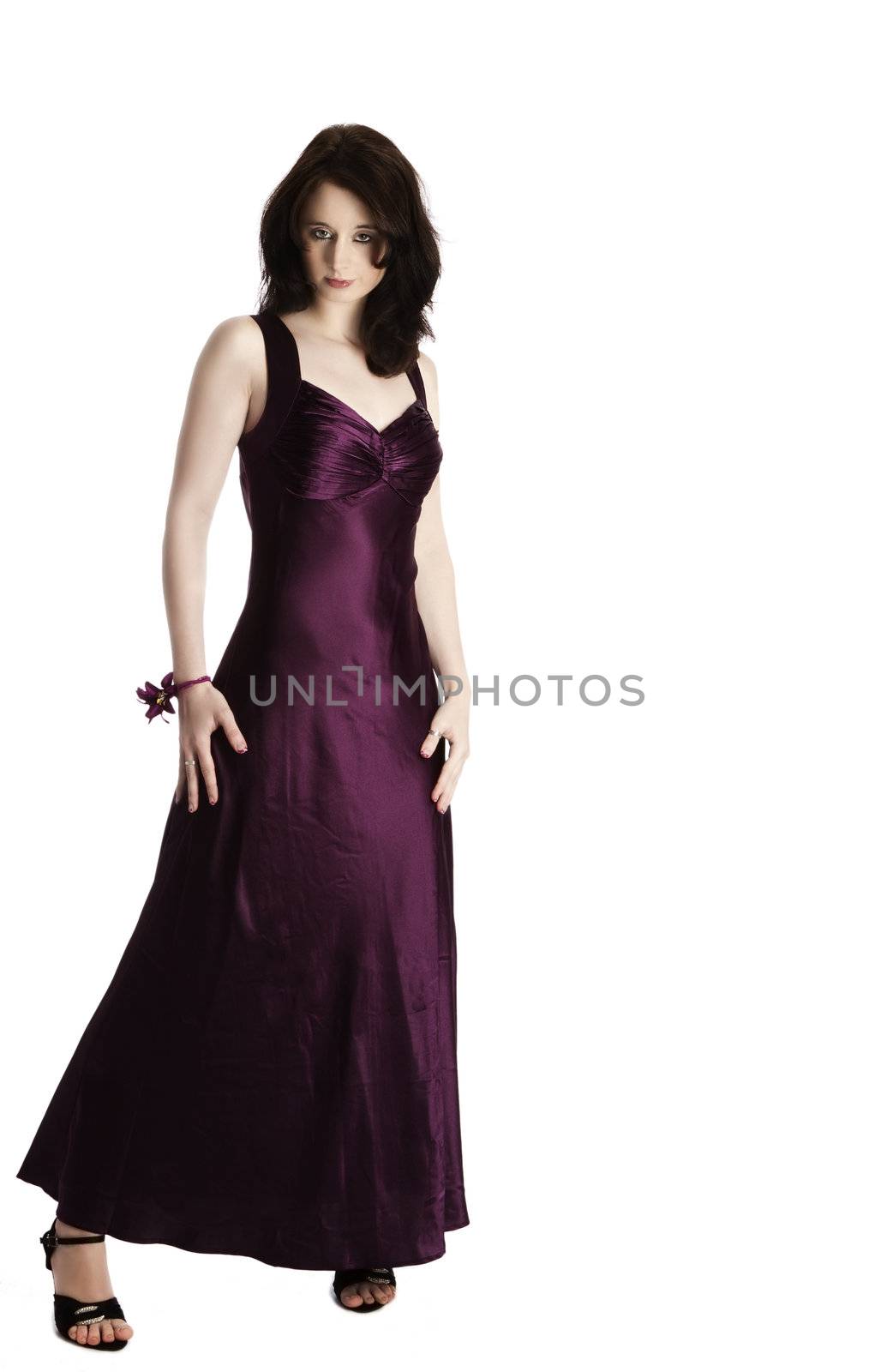 young beautiful woman standing in purple evening dress