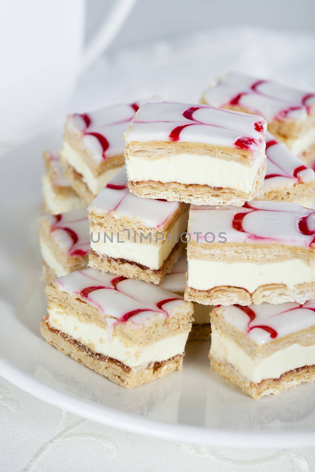 Tompouce, a common pastry in the Netherlands and Belgium.  Here with red and white icing, not the traditional pink.
