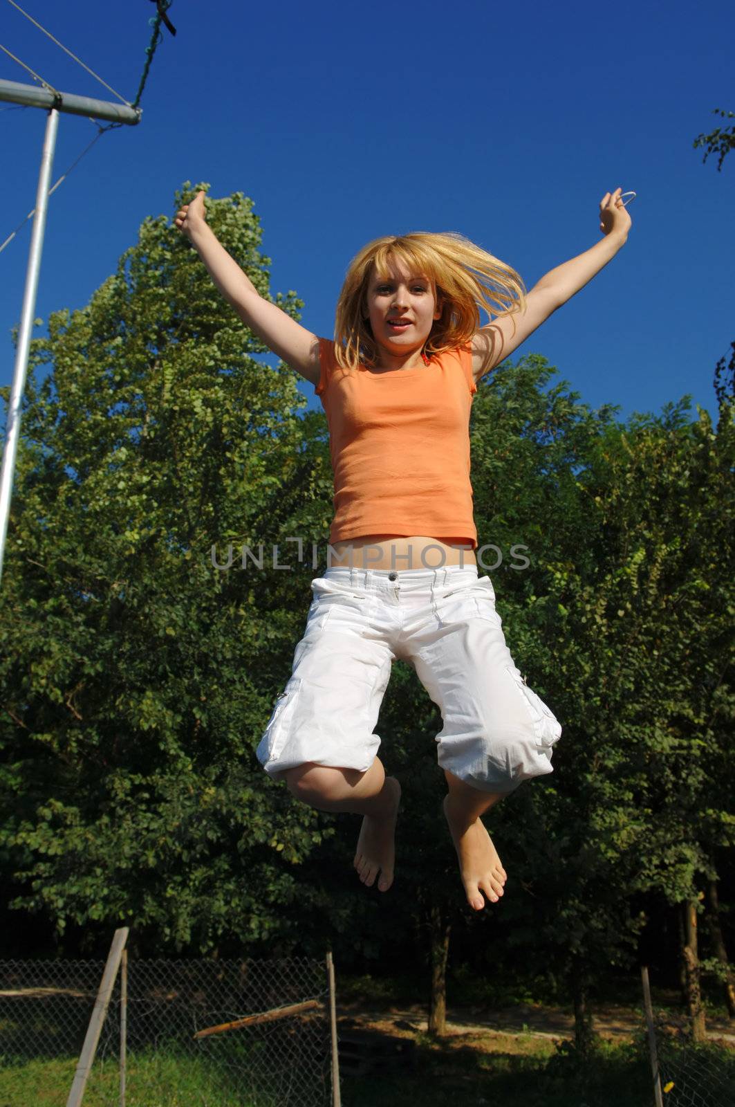 Girl Jumping on Trampoline by adamr