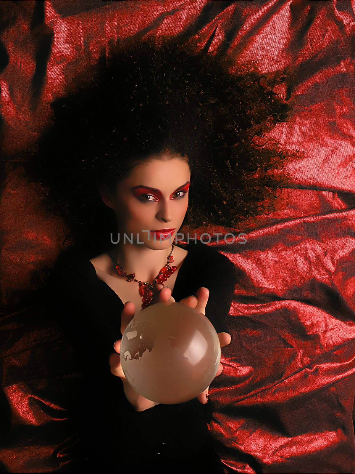 Lady With MakeUp and Crystal Ball on blue background