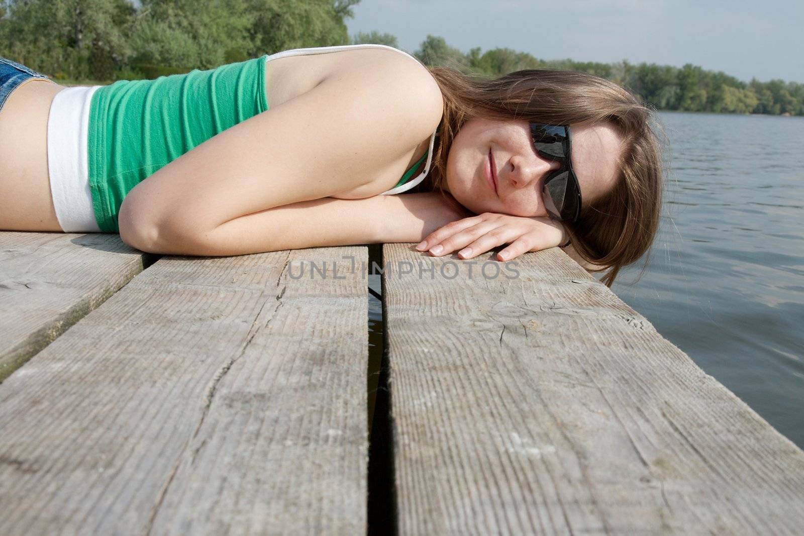 Girl on a pier enjoying vacation