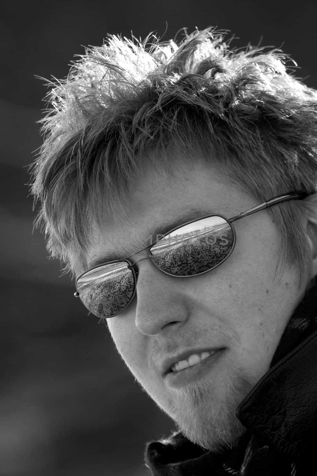 Outdoor portrait of a man with sunglasses