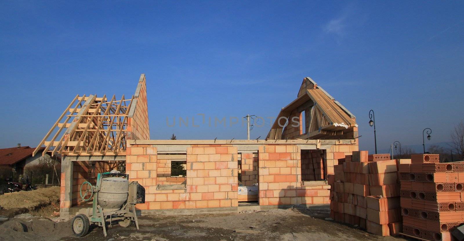 Small residential house under construction by beautiful weather