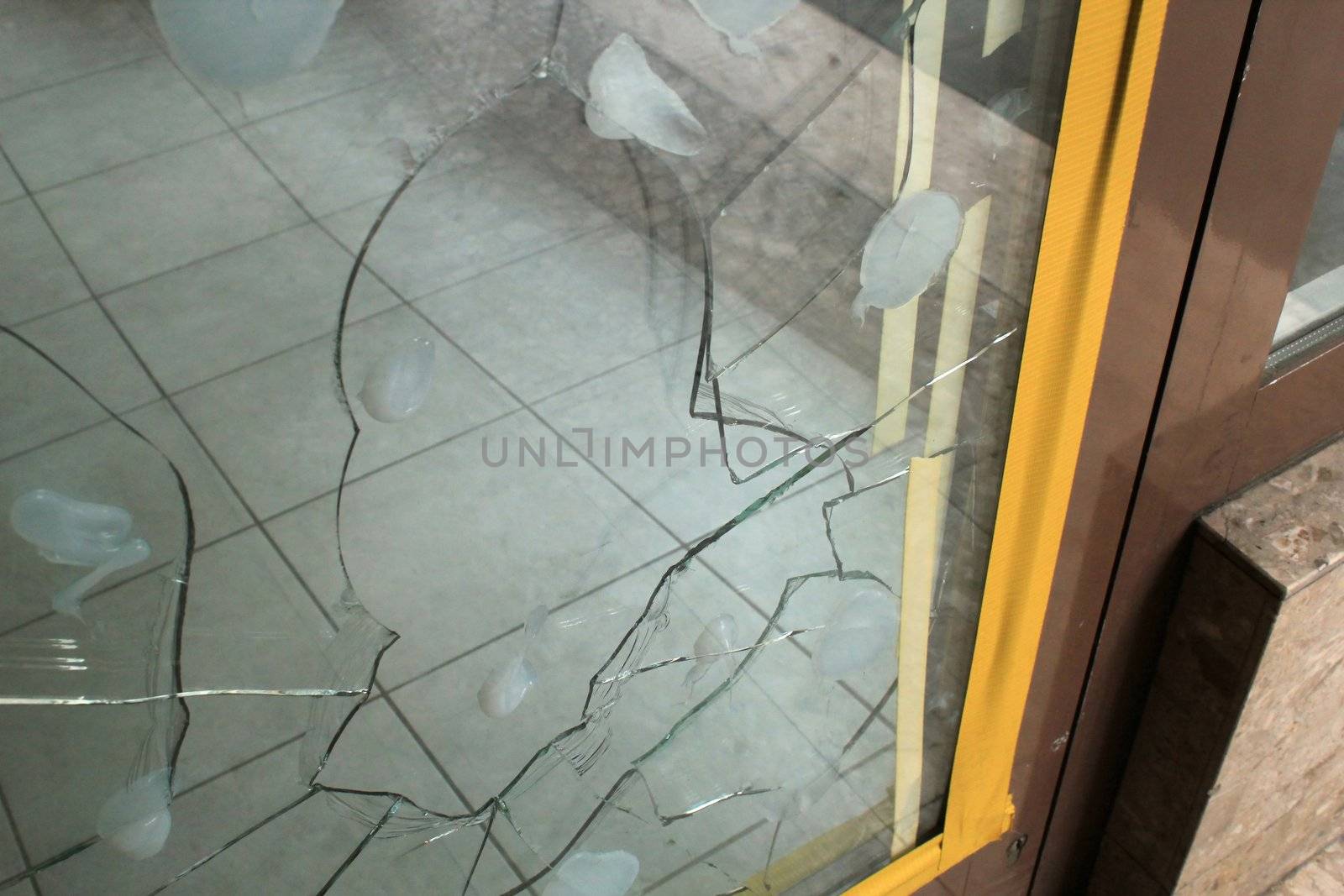 Broken glass of the entrance of a shop