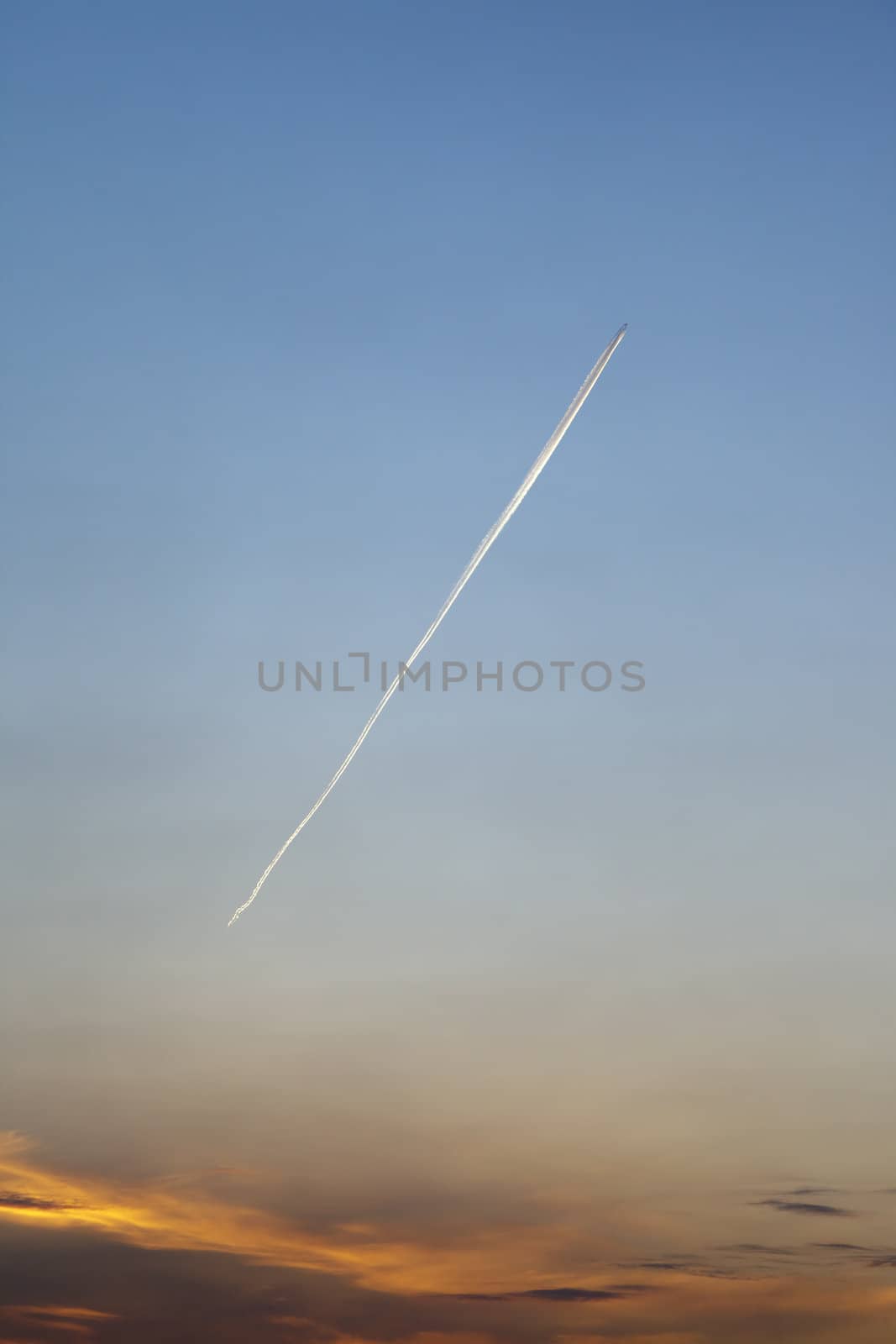 An image of a plane in the morning sky