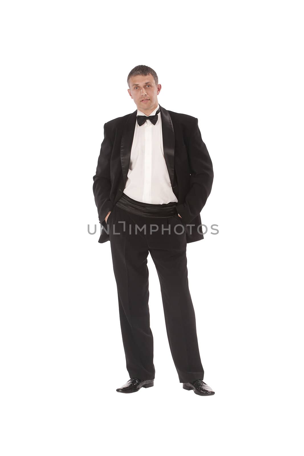 The charming imposing man tries on a new classical tuxedo for solemn ceremony