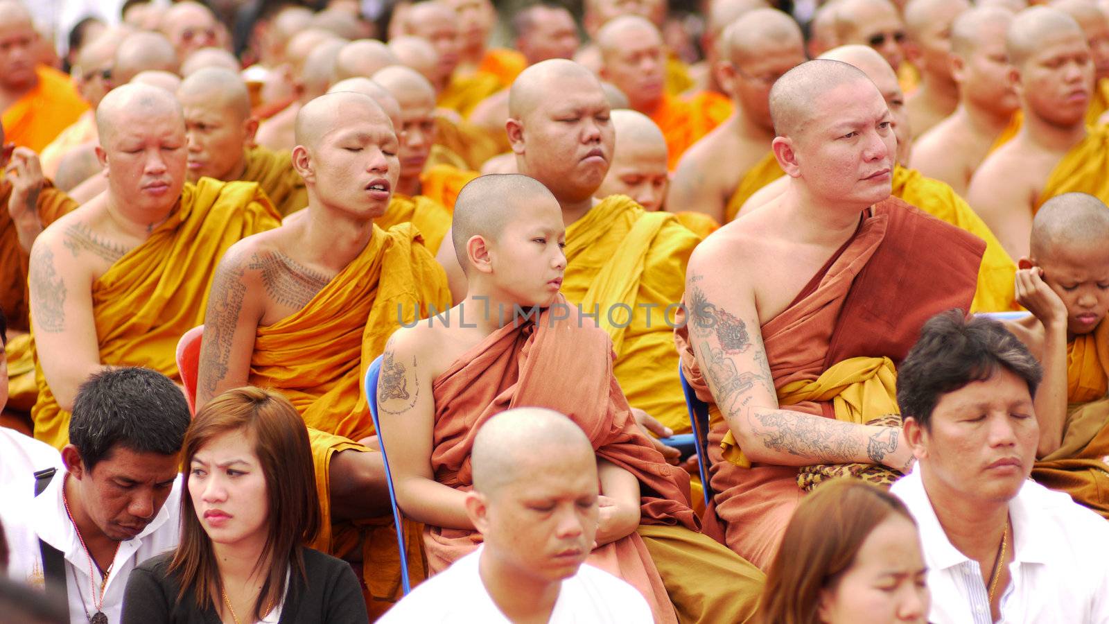 NAKHON CHAISI - MARCH 19: Monks with tattoos at the Tattoo Festival at Wat Bang Phra on March 19, 2011 in Nakhon Chaisi, Thailand.