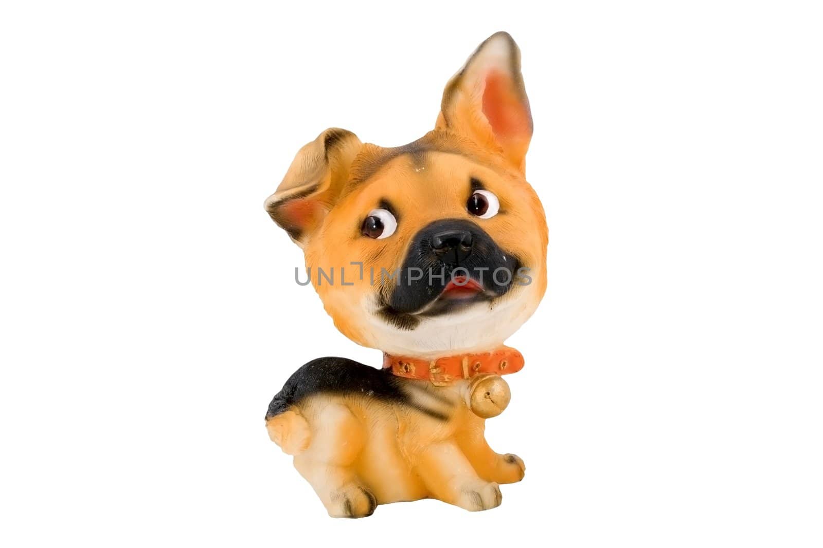 a small plastic toy doggie isolated on the white background