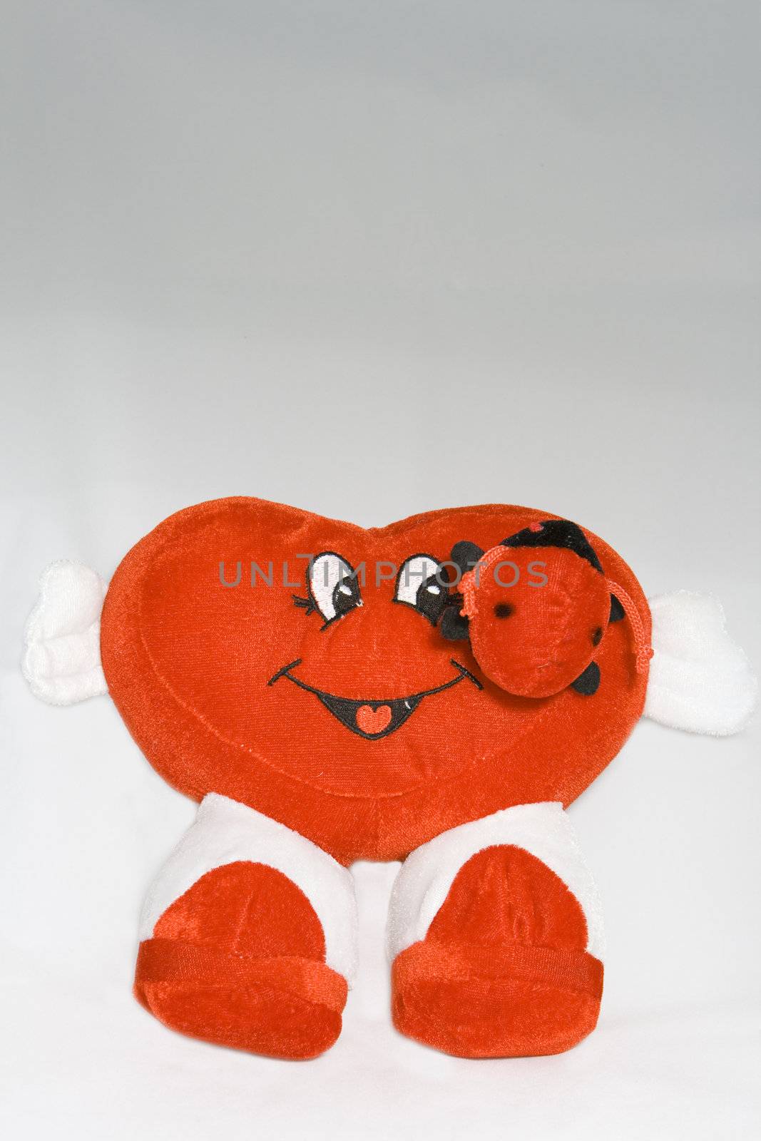 Heart shape toy with it's arms out welcoming love