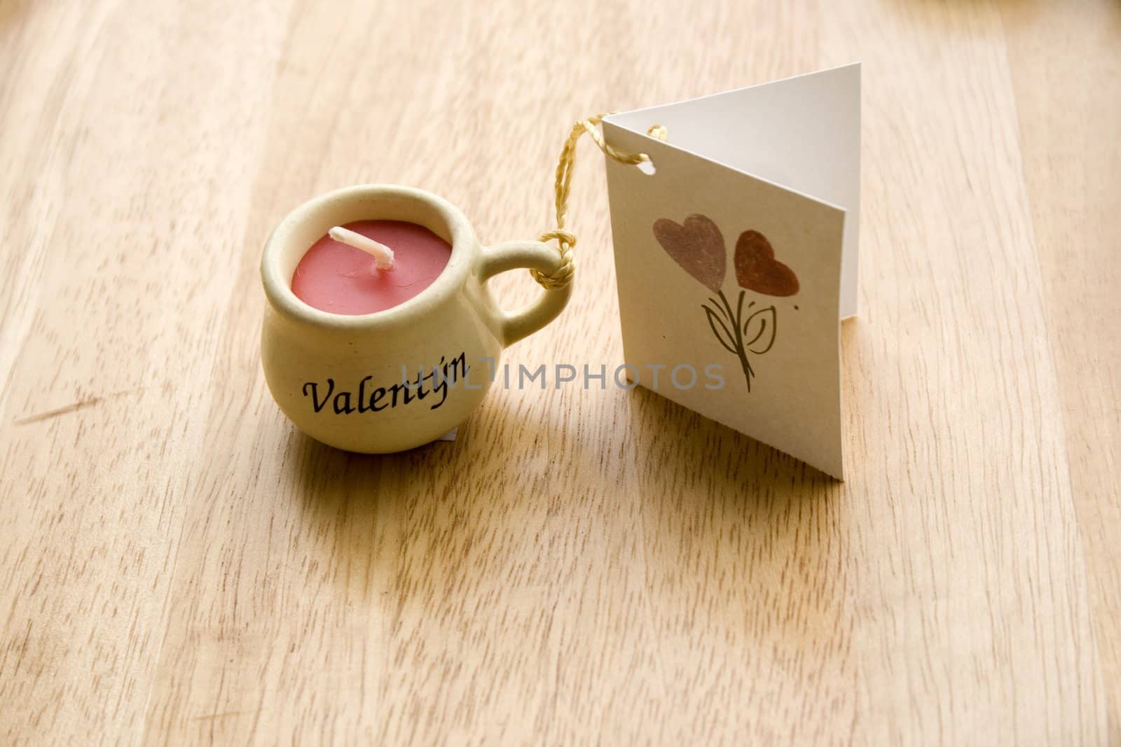 Valentine Candle with a greeting-card - close-up