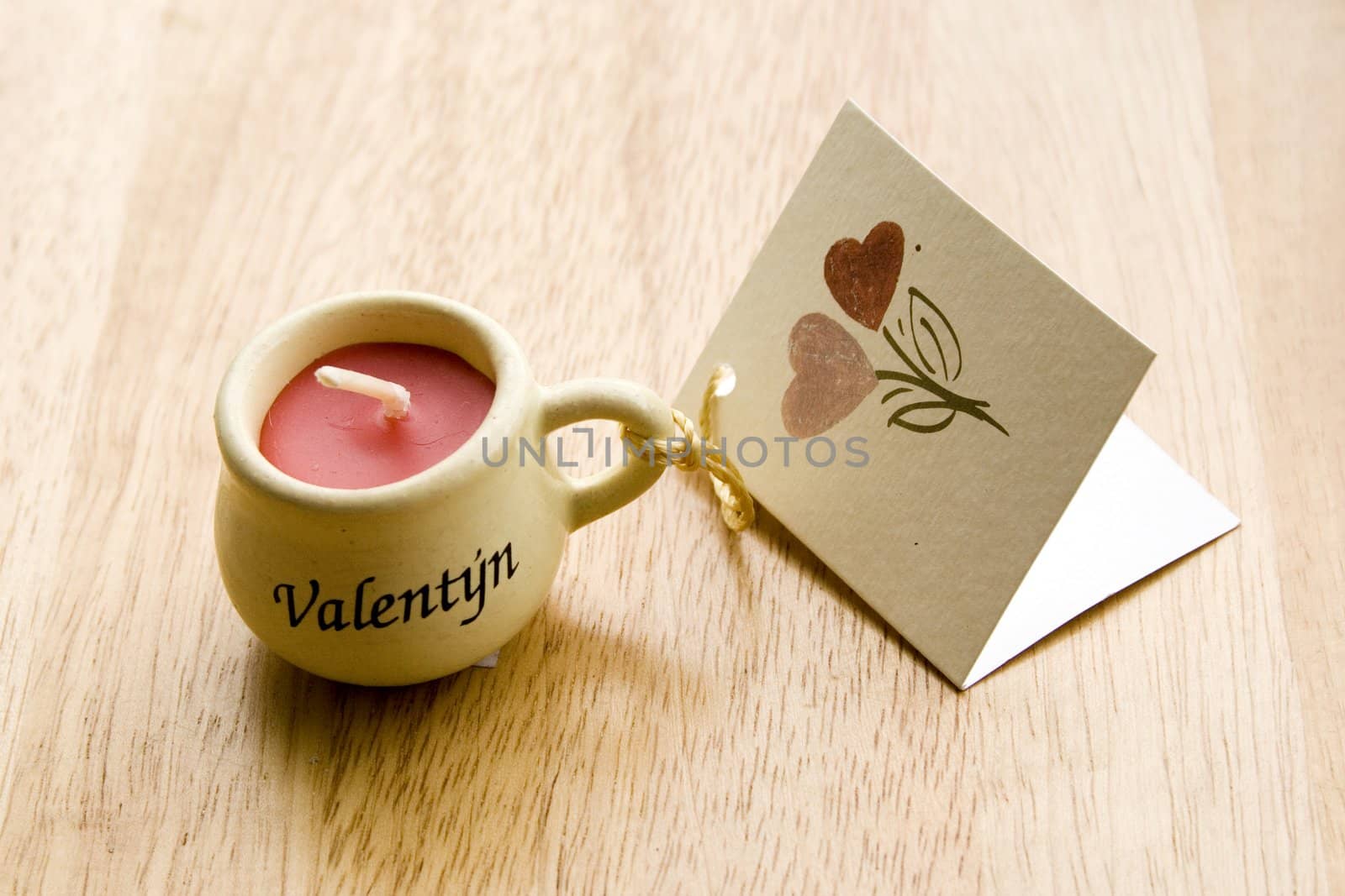 Valentine Candle with a greeting-card - close-up