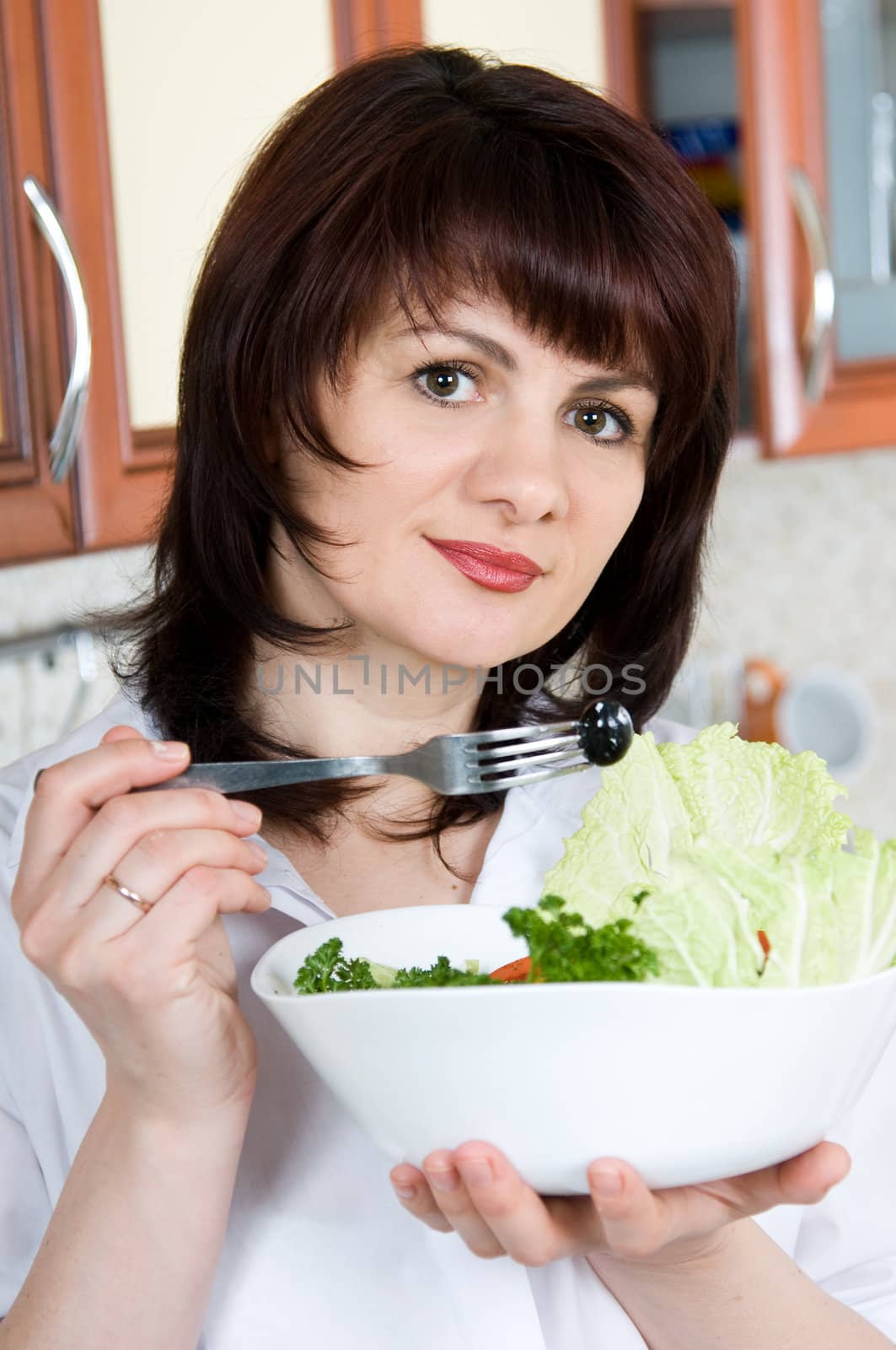 Beautiful a woman  to taste  cooked the food