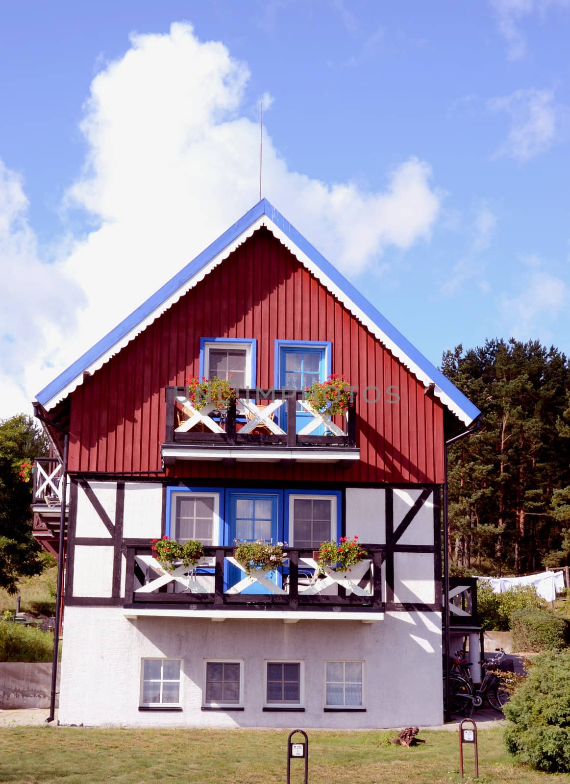 Residential house. Red, blue and white painted walls. Beautiful architectural solution.