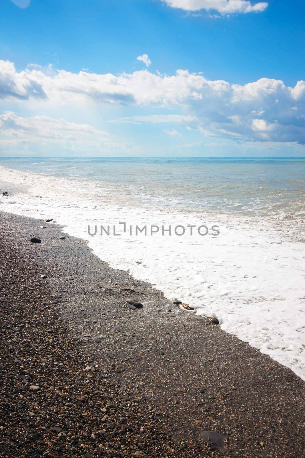 Empty beach and ocean in summertime