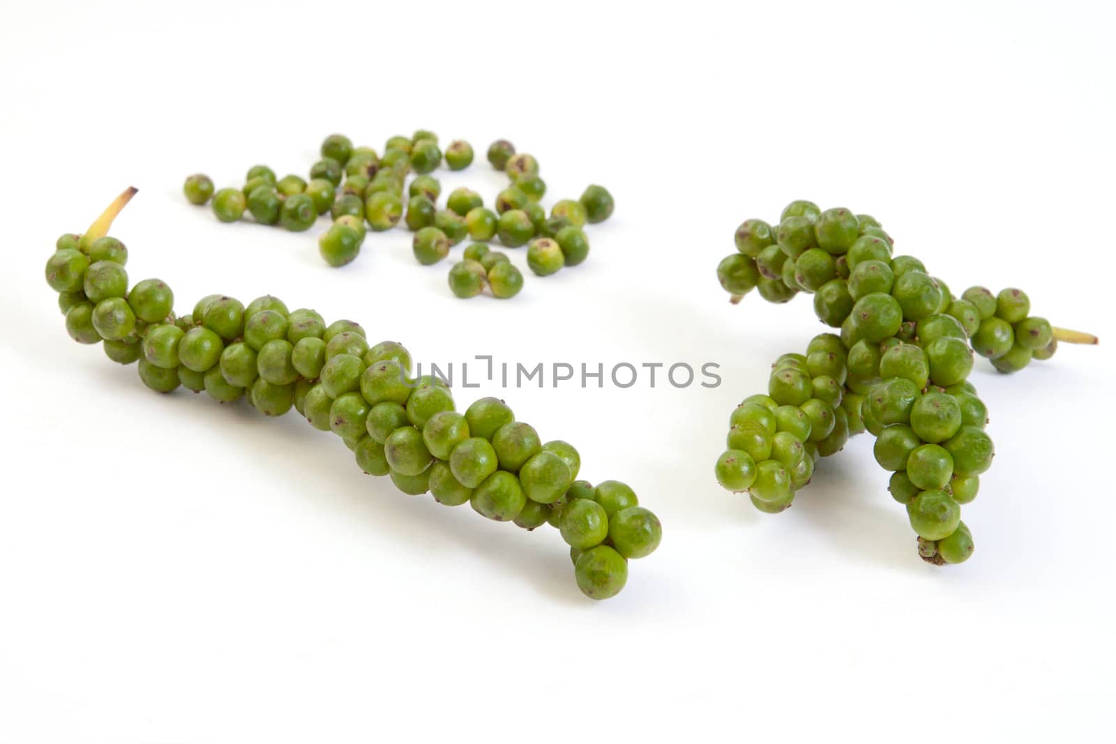 Bunches of fresh green pepper isolated on white background