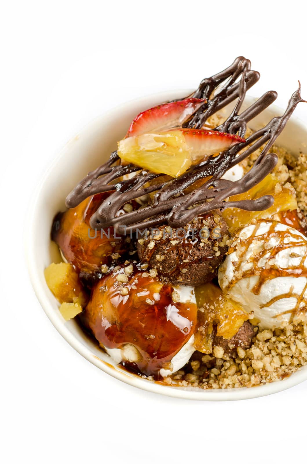 ice cream with chocolate, nuts and caramel close up