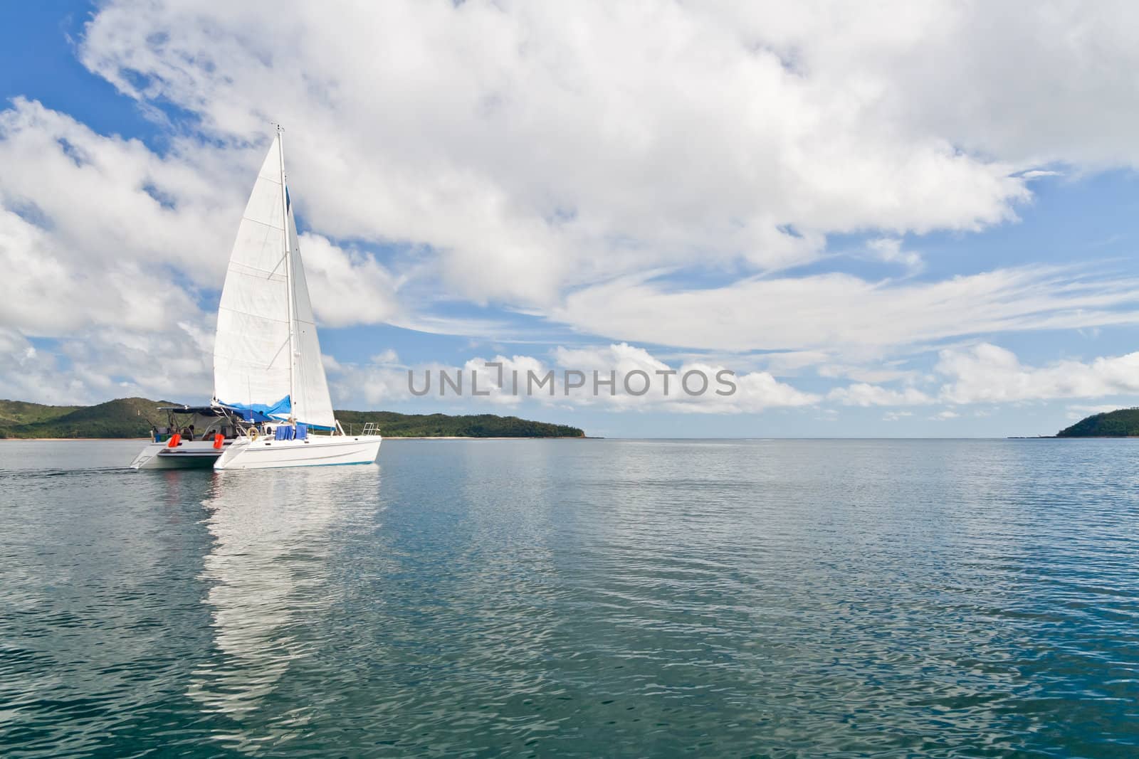 Luxury white catamaran boat in the bay