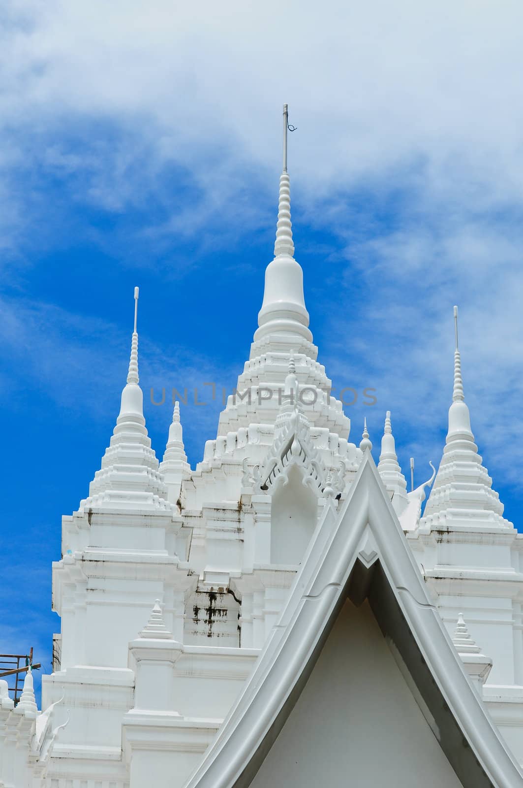 scene of white pagoda and blue sky in Thailand