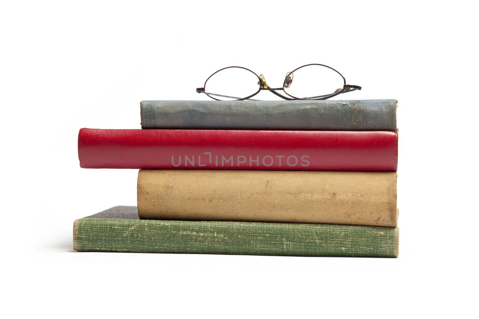 Group of Old Antique Books and eyeglasses isolated on white