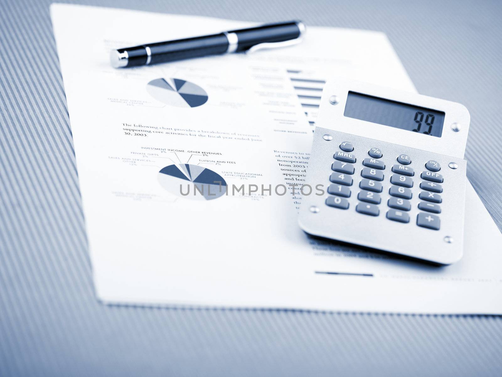 Market Analyze - pen and calculator on papers