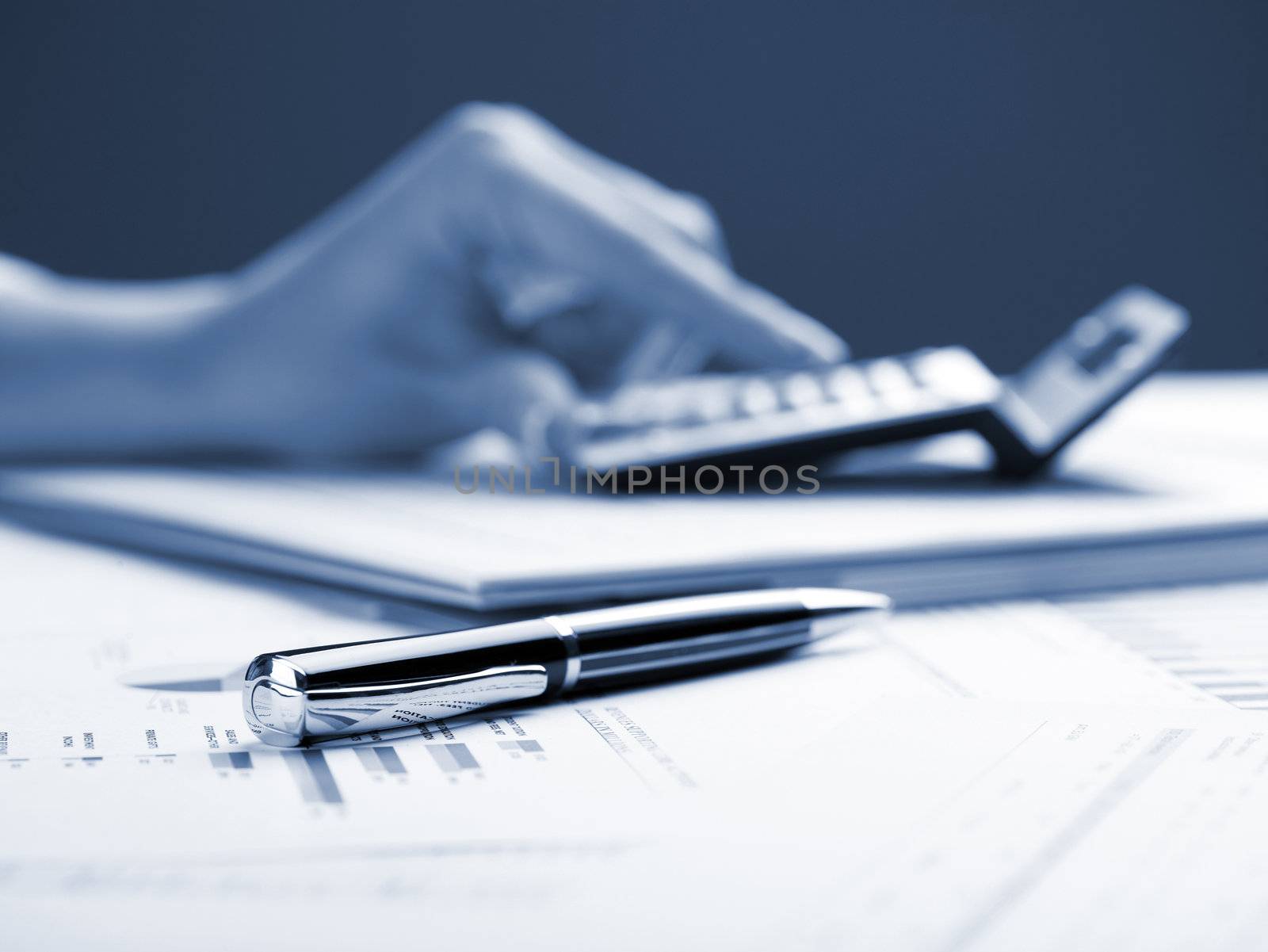 Market Analyze - pen and calculator on papers