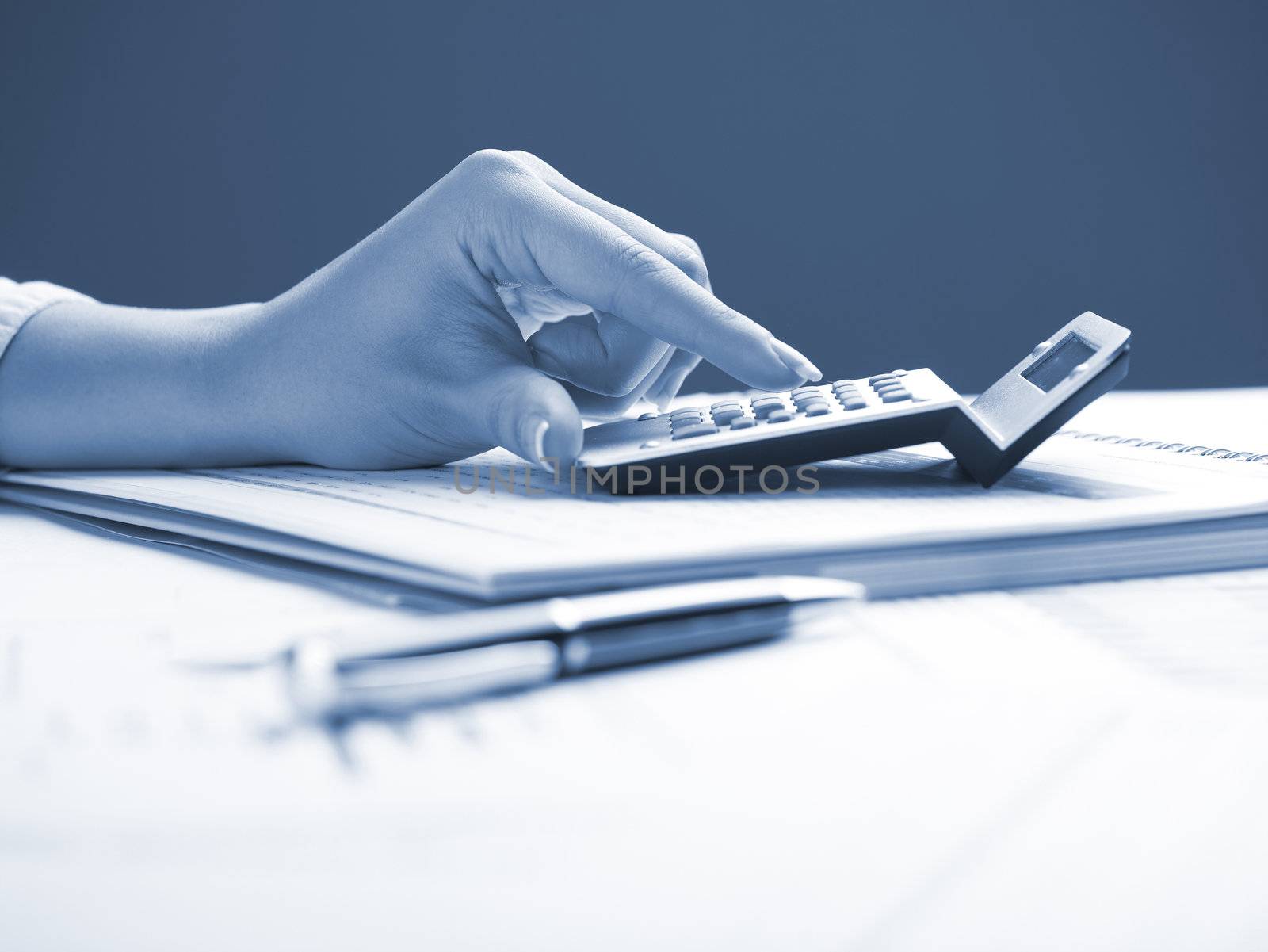 Market Analyze - pen and calculator on papers