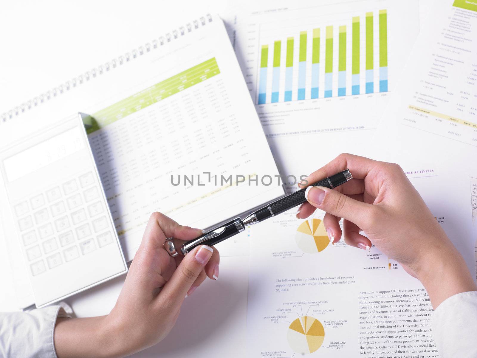 Analyzing Business Data - pen and numbers on paper
